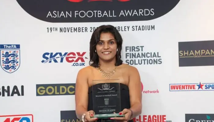 Aditi Chauhan holding her Woman in Football Award at the Asian Football Awards, Wembley Stadium