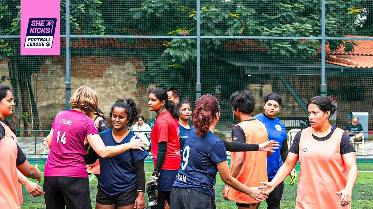 Teams shaking hands after a She Kicks Football League match